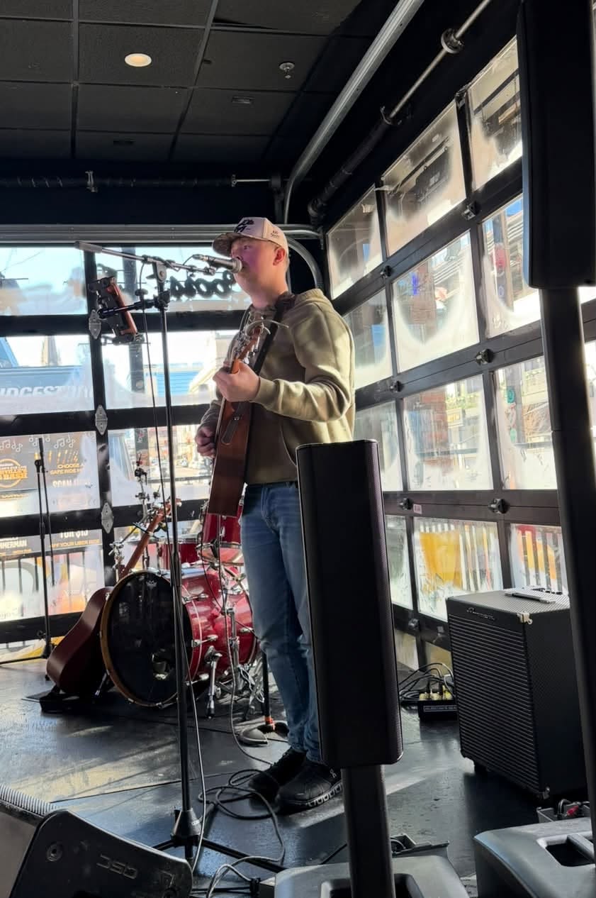 Bryce Blackwell performing live with guitar